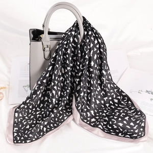 70cm leopard print silk scarf for women styled on a chic handbag with satin finish