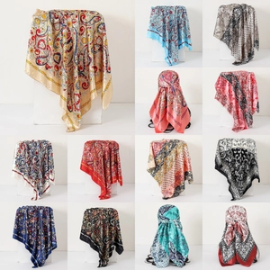 Collage of twelve paisley pattern satin scarves in various colors and floral designs