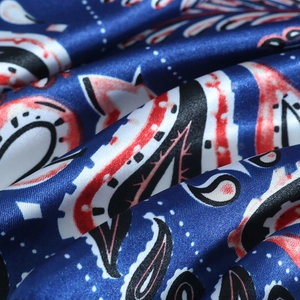 Luxurious blue paisley satin silk scarf with elegant ethnic patterns and glossy finish