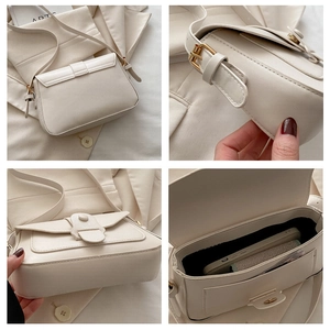 Detail view of beige crossbody bag showing golden buckle, interior storage, and fine stitching