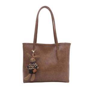 Retro brown PU leather tote bag with long shoulder straps and a cute rabbit doll charm