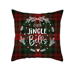 Christmas cushion cover featuring Jingle Bells text and red green tartan plaid pattern