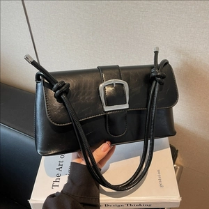 French retro black baguette bag in shiny leather with silver buckle and cord strap