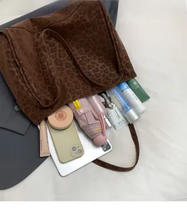 Internal view of leopard print tote bag showing spacious storage for daily items