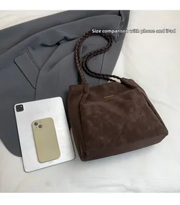 Deep brown suede tote bag with woven handles showing large capacity for iPad and phone