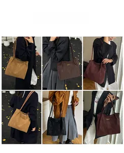 Detail view of large faux suede tote bags with woven rope straps in four vintage colors