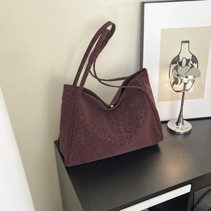 Retro leopard print tote bag in dark brown suede with spacious shoulder straps and sleek design