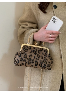 Detail showing plush leopard print texture and vintage gold metal frame with chain strap
