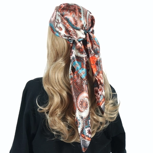 Back view of paisley satin scarf tied on head showing drape and vibrant pattern