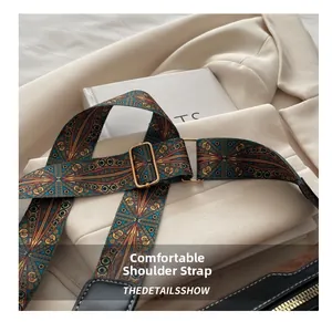 Close-up of wide bohemian jacquard shoulder strap with vintage geometric patterns