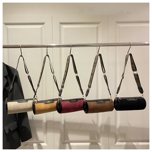 Collection of matte cylinder crossbody bags with vintage jacquard wide straps in five colors
