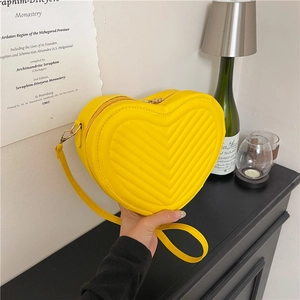 Fashionable bright yellow heart-shaped PU leather crossbody bag with V-quilted stitching