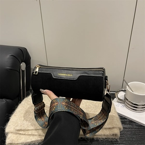Fashionable black matte cylinder bag with colorful geometric pattern wide shoulder strap
