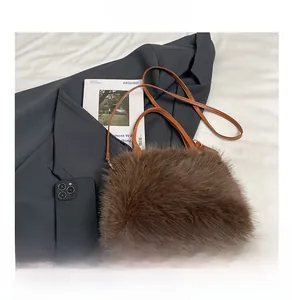 Brown faux fur plush handbag detail showing size capacity compared to a smartphone