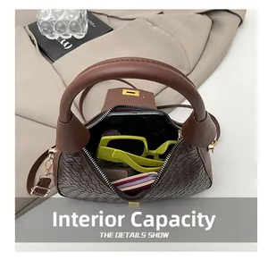 Spacious interior of brown woven handbag showing capacity for phone, wallet and sunglasses