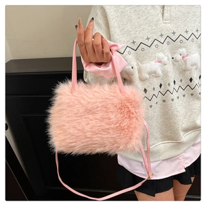 Close-up of pink faux fur texture and synthetic leather strap on a soft crossbody bag