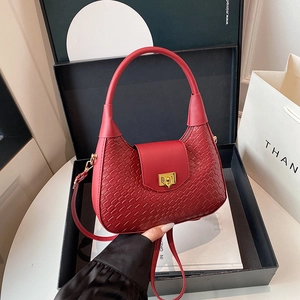 Red crescent woven bag in premium black gift box with detachable shoulder strap and gold clasp