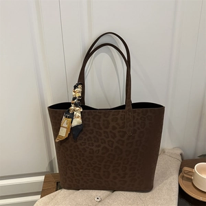 Large leopard print faux suede tote bag with decorative silk scarf and dual handles