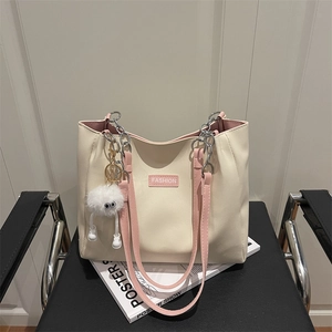 Large capacity cream tote bag with pink straps and fashion patch on textured leather