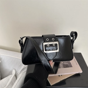 Retro black baguette bag with silver belt buckle detail and sleek shoulder strap design