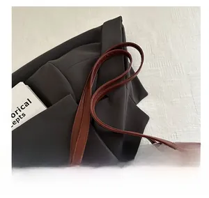 Detailed close-up of premium burgundy PU leather shoulder bag straps with neat stitching