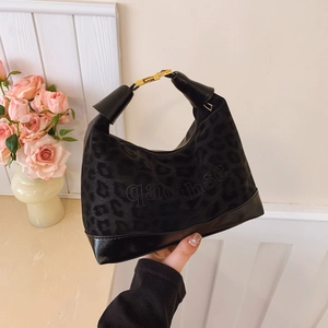 Fashionable black leopard pattern dumpling bag with gold buckle and top handle for women