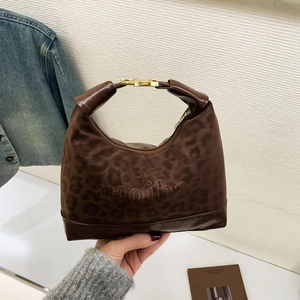 Fashionable dark brown leopard print hobo handbag with gold buckle and top handle