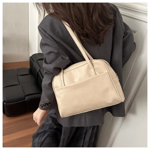 Model wearing a beige PU leather shoulder bag showing the size and rectangular shape