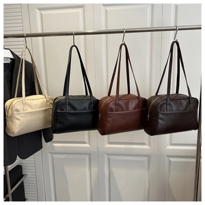 Row of minimalist PU leather shoulder bags in beige, black, caramel, and dark brown colors
