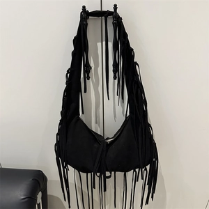 Retro black faux suede hobo bag with fringe tassels and wide shoulder strap