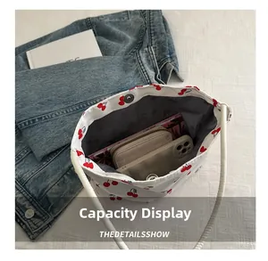 Internal view of cherry print canvas tote showing magnetic closure and spacious capacity