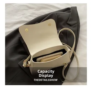Top view of cream white PU leather bag showing interior capacity and magnetic clasp