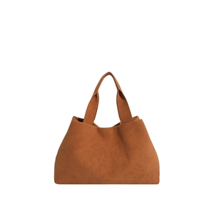 Minimalist brown suede tote bag with wide handles for daily commute on white background