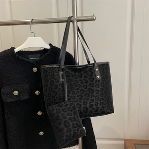 Chic black leopard print tote bag set with matching pouch and stylish gold rivets
