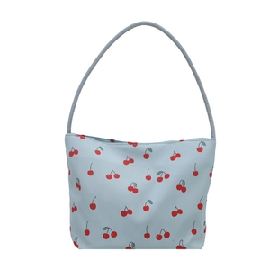 Chic blue nylon bucket bag featuring red cherry prints and matching shoulder strap