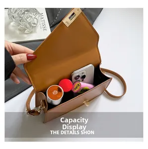 Spacious interior of brown crocodile-patterned bag showing daily storage capacity