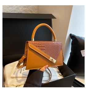 Brown faux leather crossbody bag featuring crocodile texture and gold hardware detail