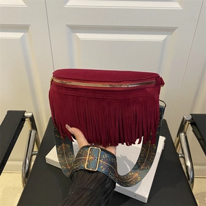 Bohemian burgundy fringe crossbody bag with ethnic patterned wide shoulder strap