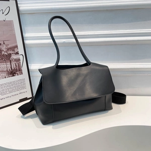 Minimalist black large capacity crossbody bag with wide shoulder strap in matte finish