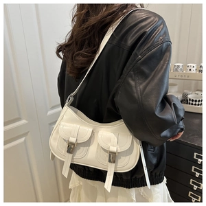 Detailed back view of a white PU leather half-moon shoulder bag with dual buckle pockets