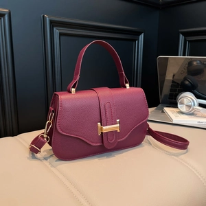 Chic burgundy lychee leather handbag with gold H buckle and adjustable shoulder strap