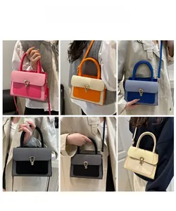 Detail view of stylish crossbody bags in five colors with woven flap and horseshoe metal lock