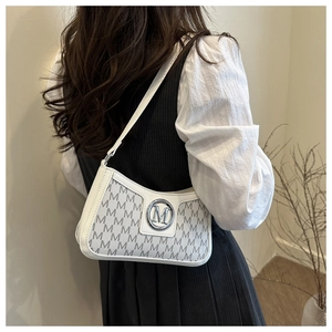 Detailed close-up of a white monogram shoulder bag with a metallic silver M-logo buckle
