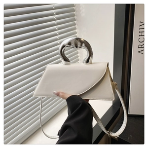 White leather handbag with liquid silver metal handle and asymmetrical flap design