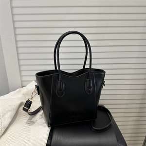 Classic black leather tote bag with wavy rim and adjustable shoulder strap for women