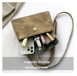 Internal view showing the storage capacity of the brown vintage leather crossbody bag