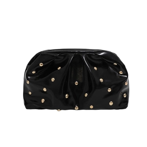 Chic black pleated cloud bag with metallic gold rivets and shiny synthetic leather