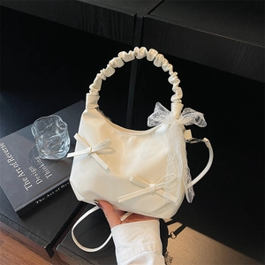White pleated cloud crescent bag with lace bow and ruched handle for casual wear