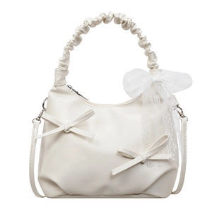 White minimalist bucket bag with lace bow charm and ruffled handle for women