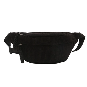 Minimalist black corduroy fanny pack with dual zippers and adjustable crossbody strap